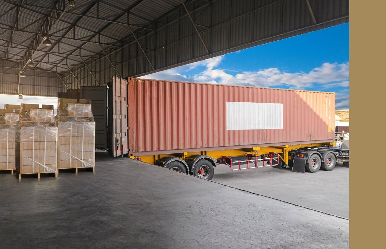 Truck in loading doc with cargo in boxes