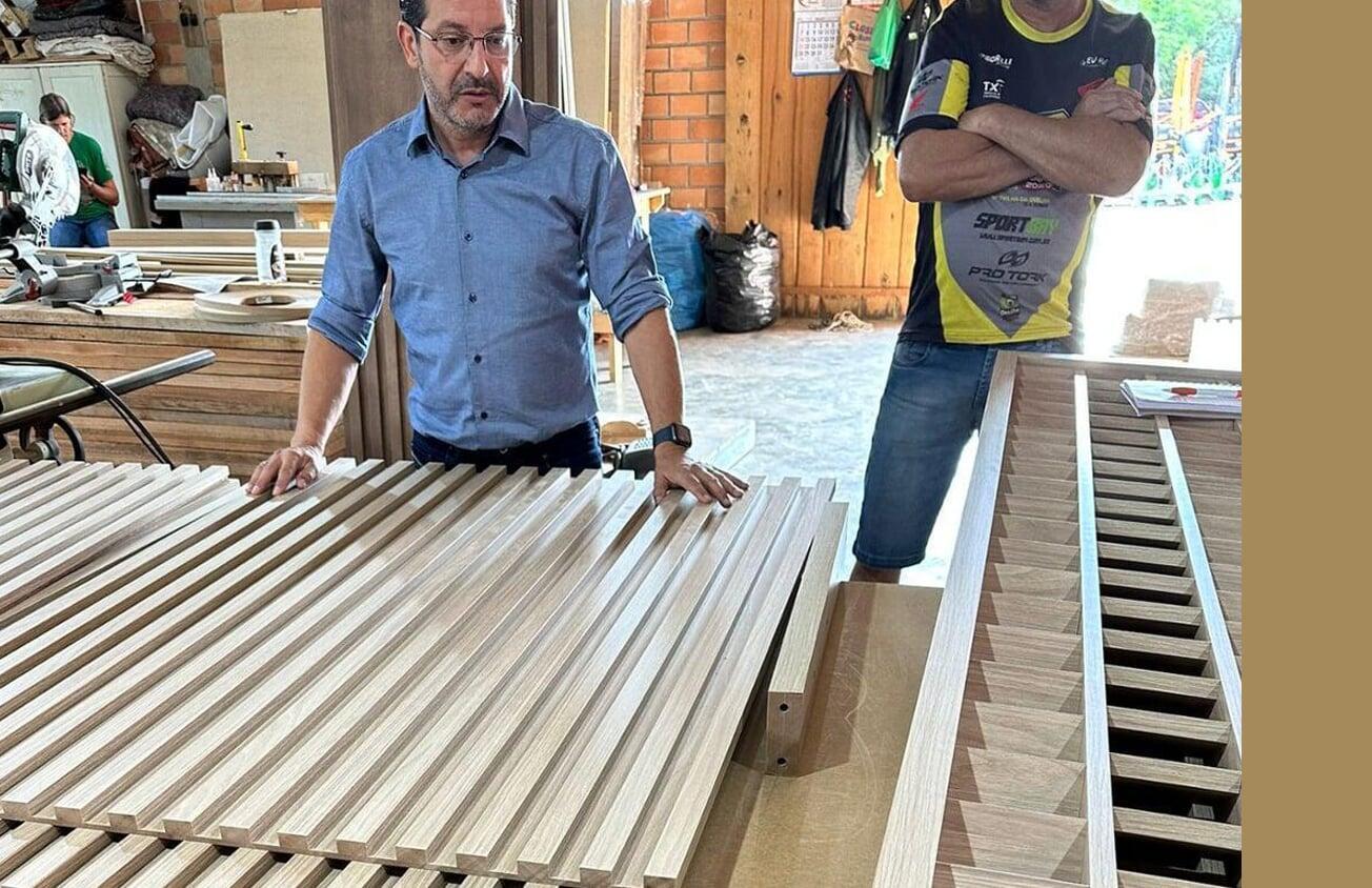 Man with raw wood materials