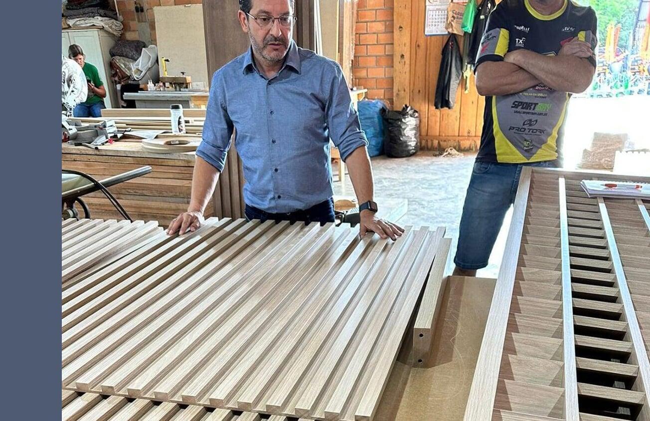 Man with raw wood materials